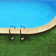 The Benefits of Installing Artificial Turf Around Your Swimming Pool